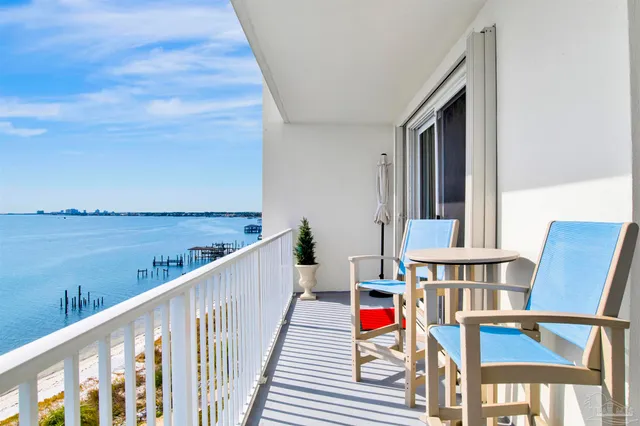 a view of a dining room with furniture and a flat screen tv