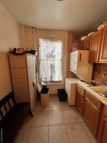 a kitchen with a refrigerator and a stove