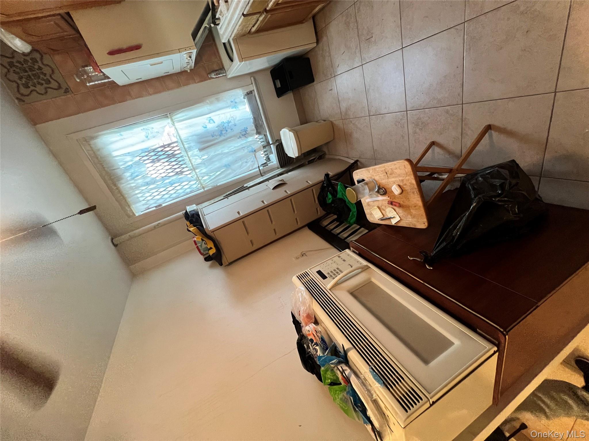 829 Southern Boulevard, Unit 3D Bronx, NY 10459 - Photo 4 of 11 a room with storage and utility