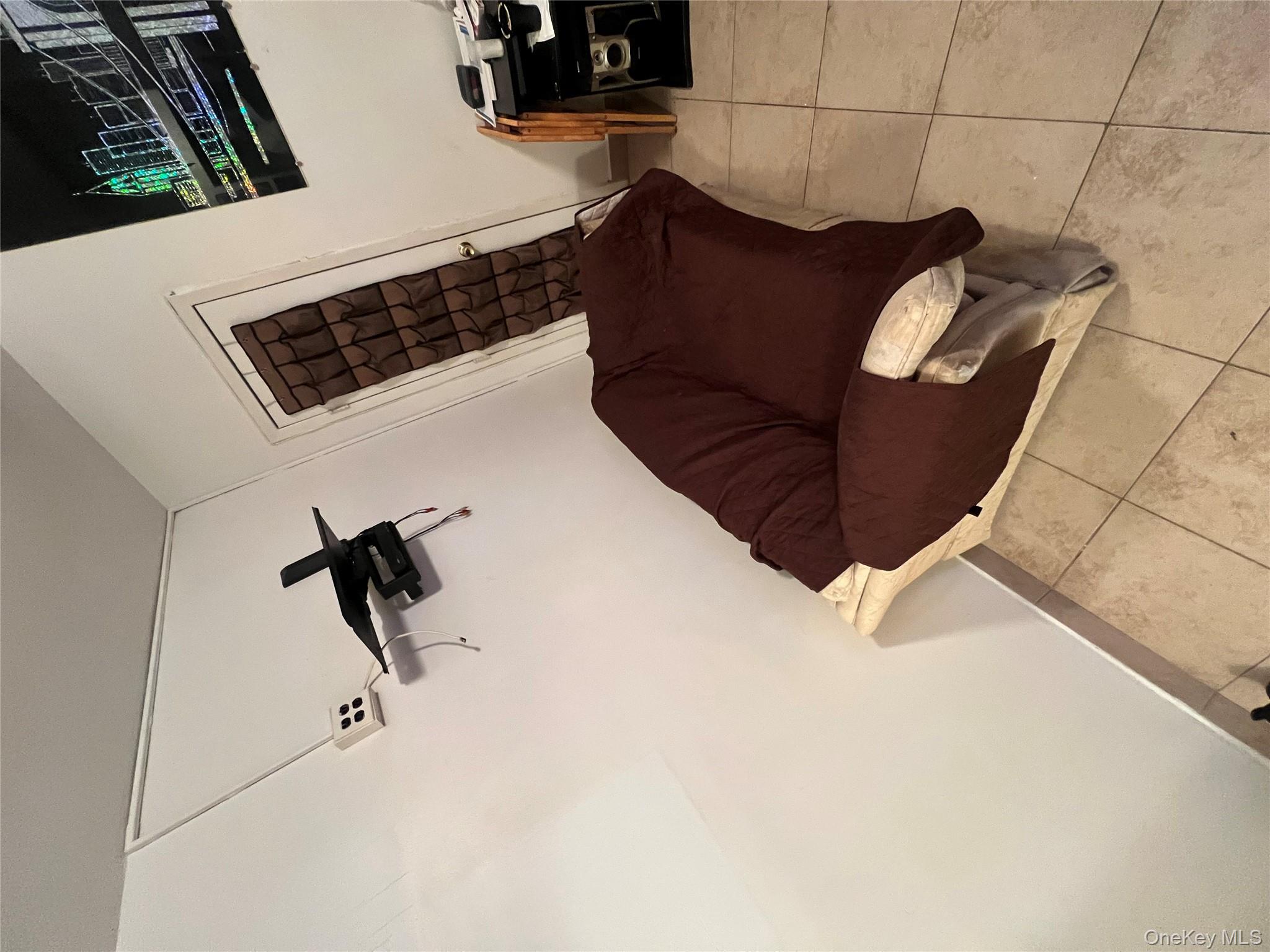 829 Southern Boulevard, Unit 3D Bronx, NY 10459 - Photo 7 of 11 a living room with furniture