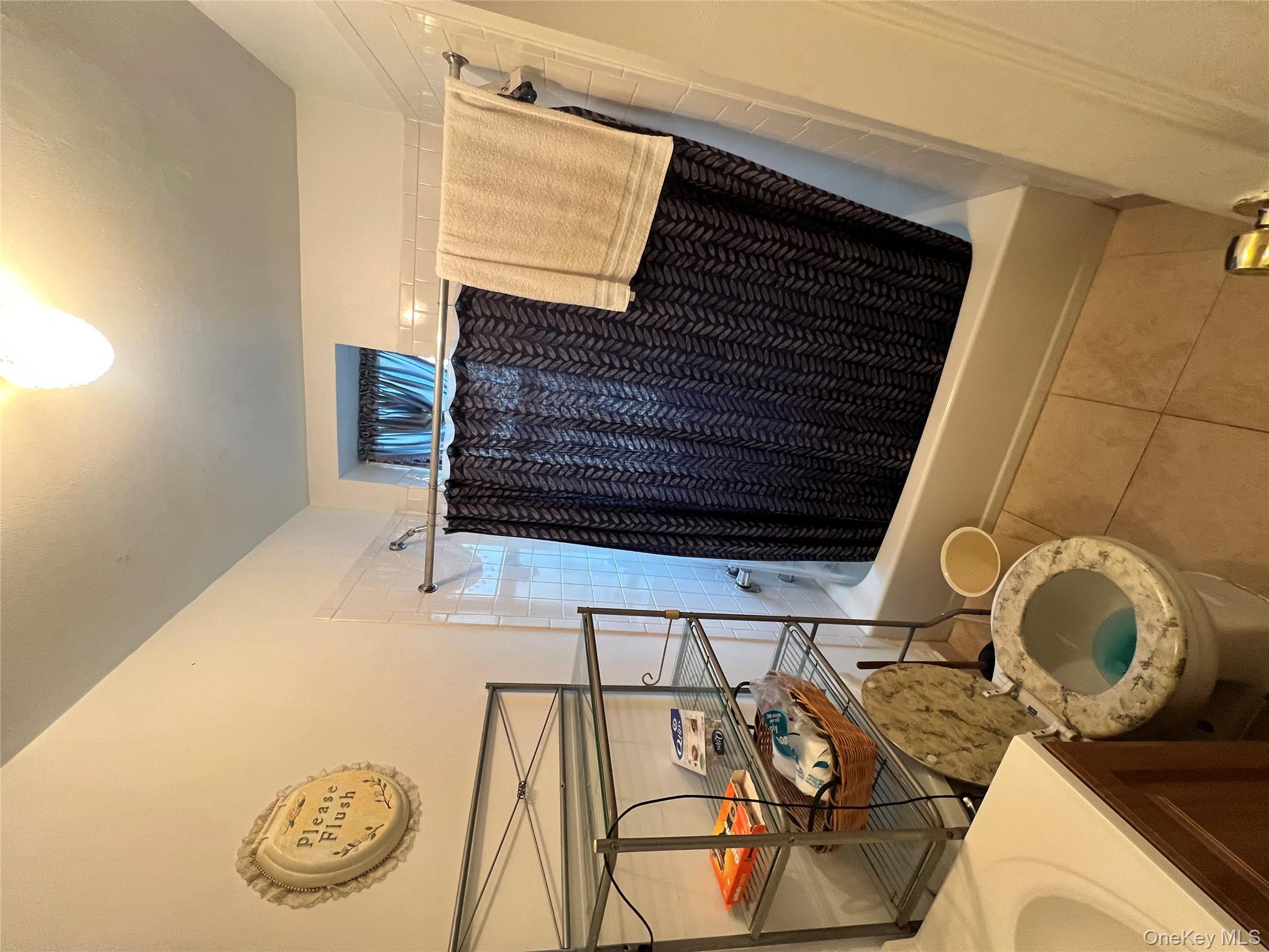 829 Southern Boulevard, Unit 3D Bronx, NY 10459 - Photo 9 of 11 a bathroom with a sink and a mirror