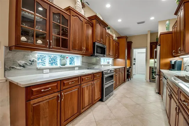 a bedroom with a bed and a lamp on dresser