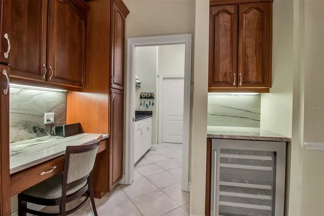 a bathroom with a granite countertop sink a toilet and a mirror