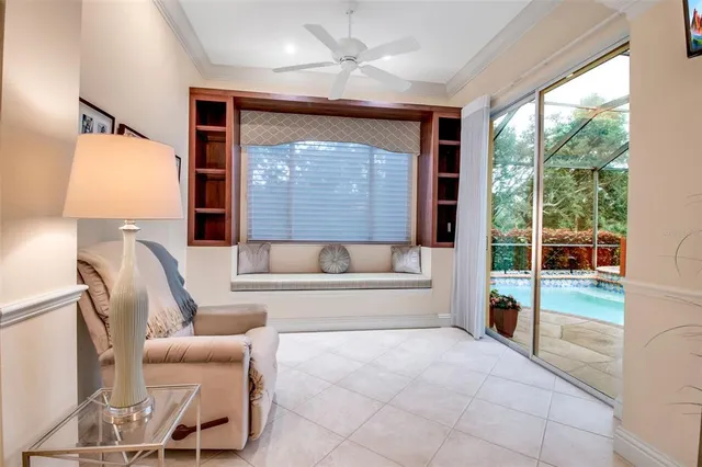 a front view of a house with a yard and potted plants