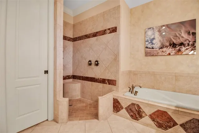 an aerial view of residential house with outdoor space and trees all around