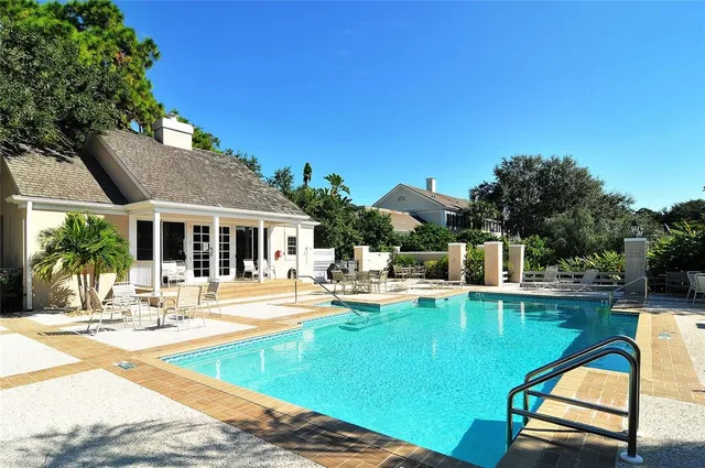 a view of small yard in front of house with a yard