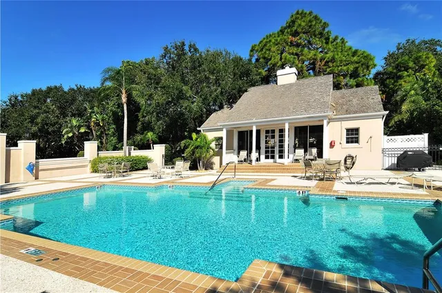 a view of a backyard with large trees