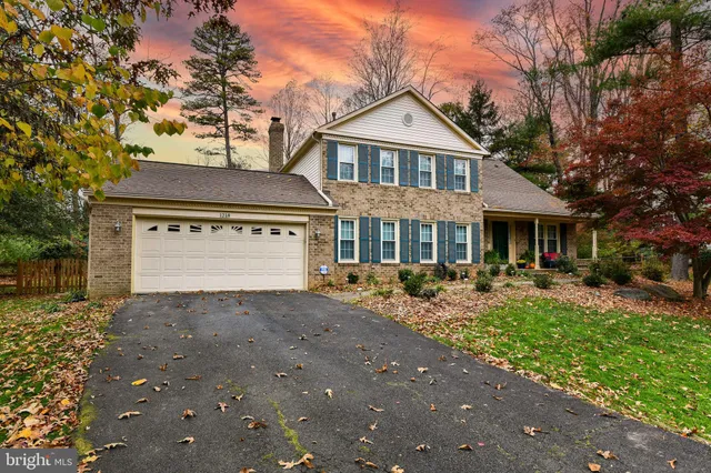 a front view of a house with yard porch and outdoor seating