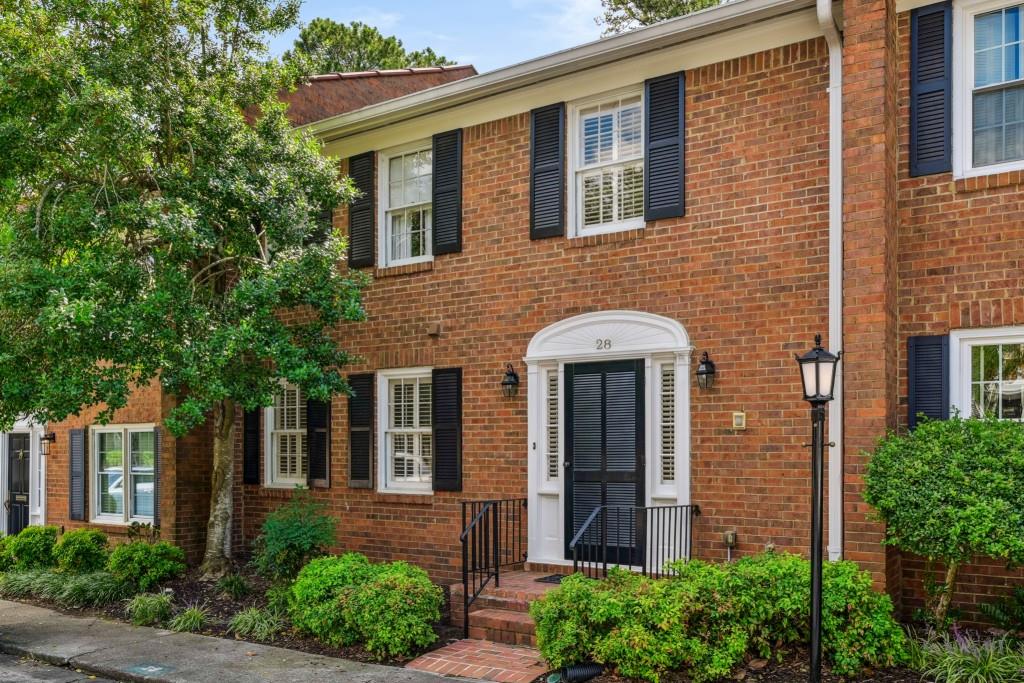 4620 Wieuca Road Northeast, Unit 28 Atlanta, GA 30342 - Photo 1 of 1 a front view of a house with garden
