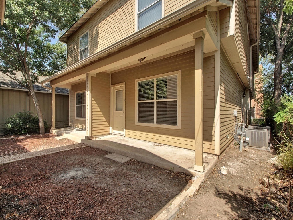 2906 Pearl Street, Unit B Austin, TX 78705 - Photo 1 of 1 a front view of a house with a yard and garage