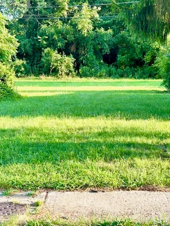 a view of a golf course with a lake