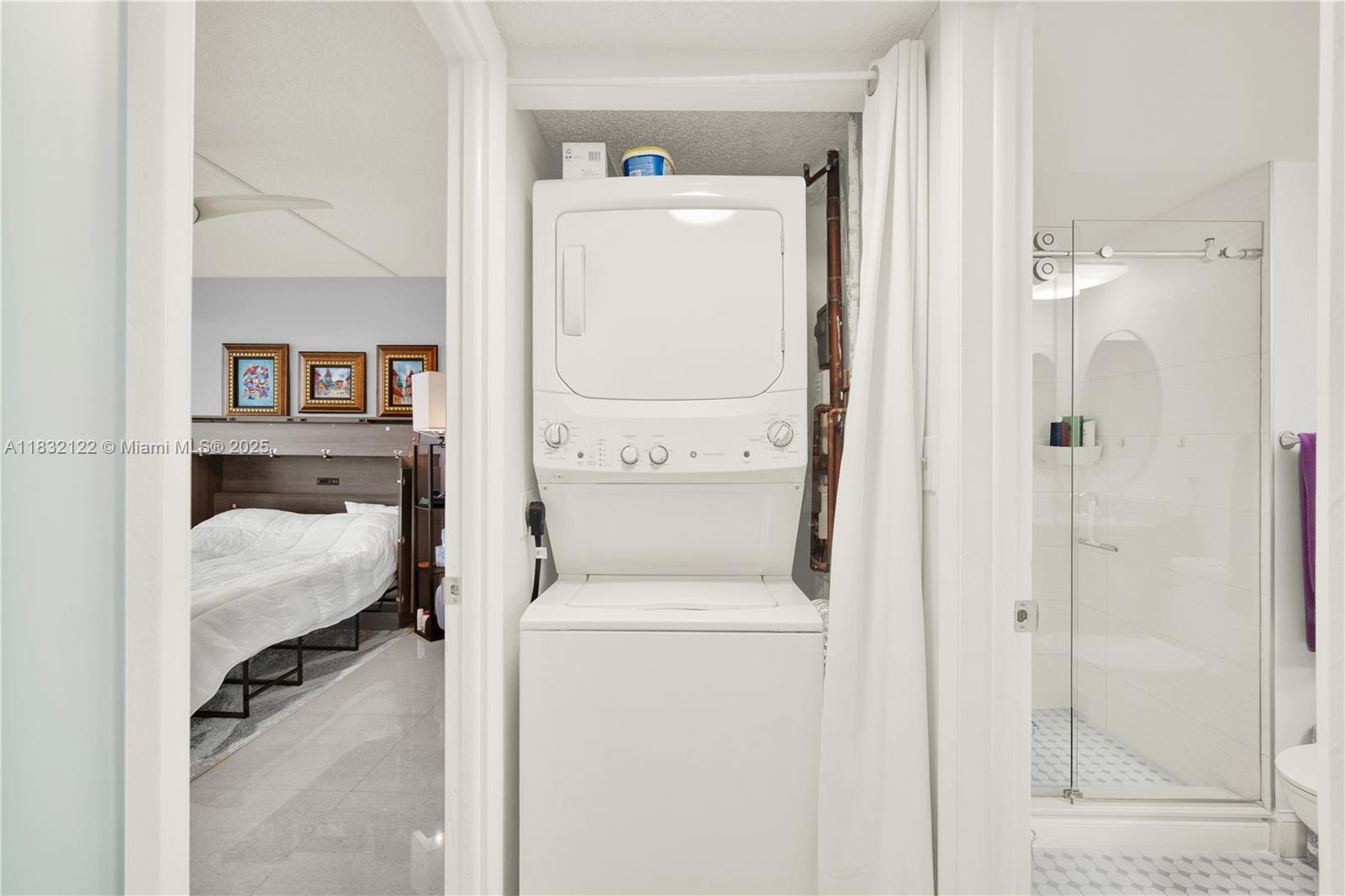 521 North Riverside Drive, Unit 707 Pompano Beach, FL 33062 - Photo 16 of 50 a utility room with dryer and washer