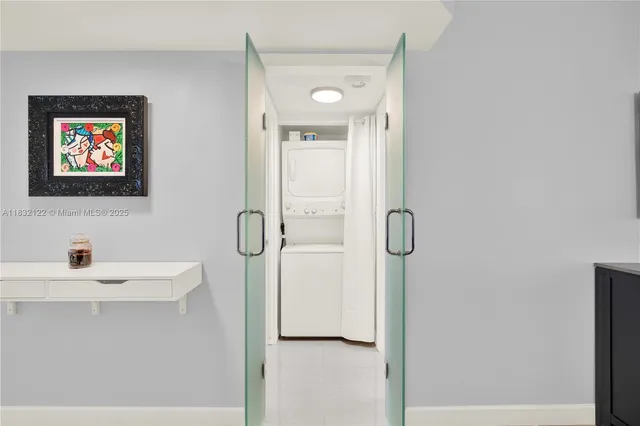 a bathroom with a shower a mirror and a sink