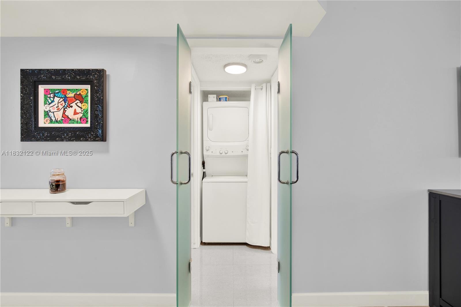 521 North Riverside Drive, Unit 707 Pompano Beach, FL 33062 - Photo 17 of 50 a bathroom with a shower a mirror and a sink