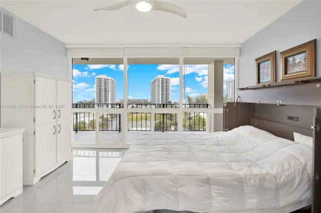 a large white bed in a blue kitchen