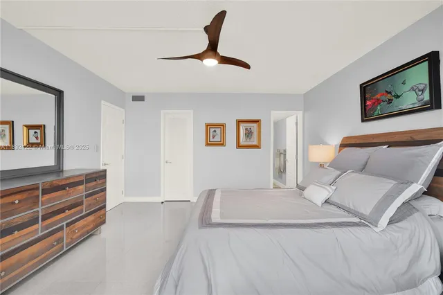 a bed room with a bed and a television