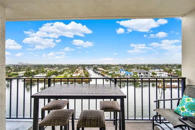 a view of a balcony with chairs
