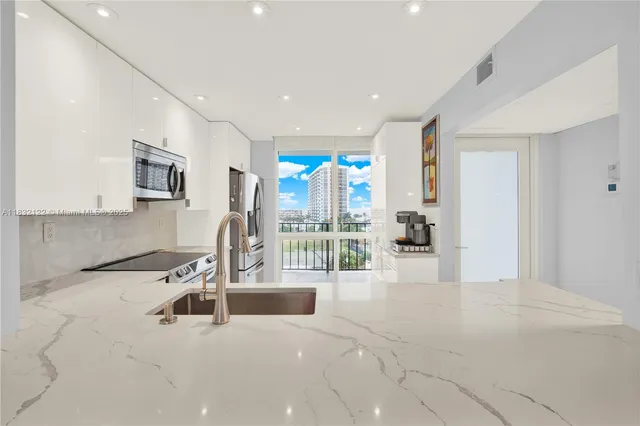 a view of a living room and chandelier