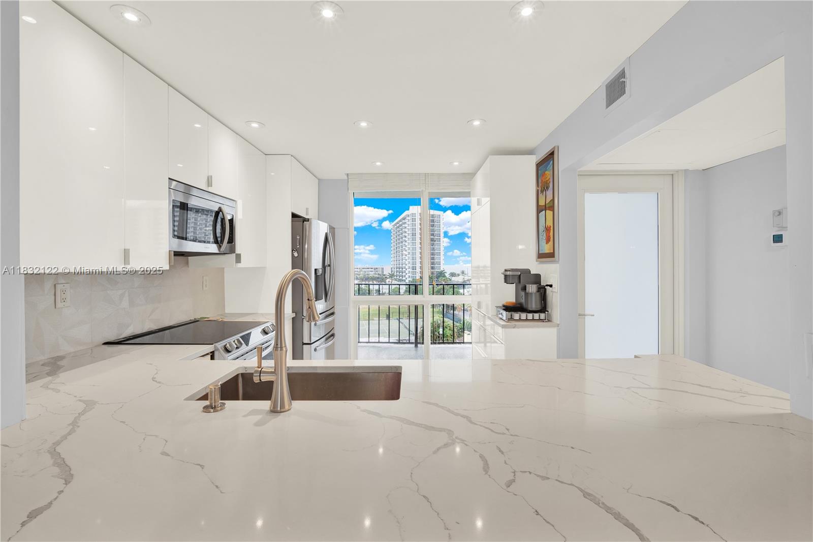 521 North Riverside Drive, Unit 707 Pompano Beach, FL 33062 - Photo 3 of 50 a view of a living room and chandelier