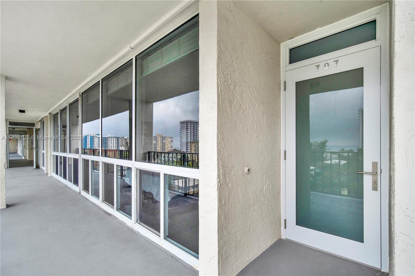521 North Riverside Drive, Unit 707 Pompano Beach, FL 33062 - Photo 34 of 50 a view interior of a house with wooden floor and windows