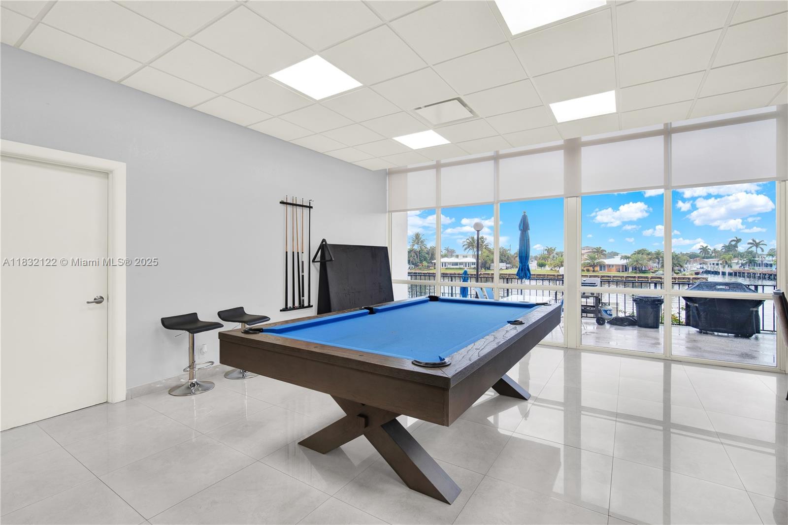 521 North Riverside Drive, Unit 707 Pompano Beach, FL 33062 - Photo 39 of 50 a room with pool table and windows