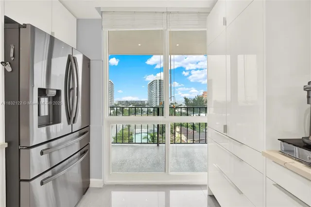 a kitchen with stainless steel appliances a refrigerator and a counter