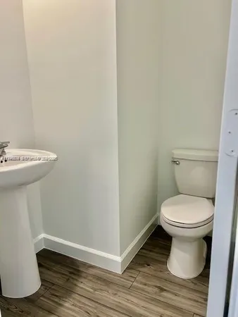 a bathroom with a toilet and a sink