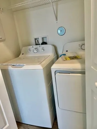 a utility room with dryer and washer