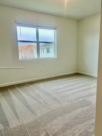 a view of wooden floor and window