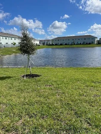 a view of a lake with a big yard