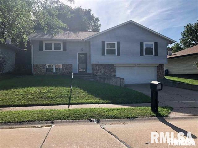 3218 Fairhaven Road Davenport, IA 52807 - Photo 3 of 7 a view of a house with a yard and a street