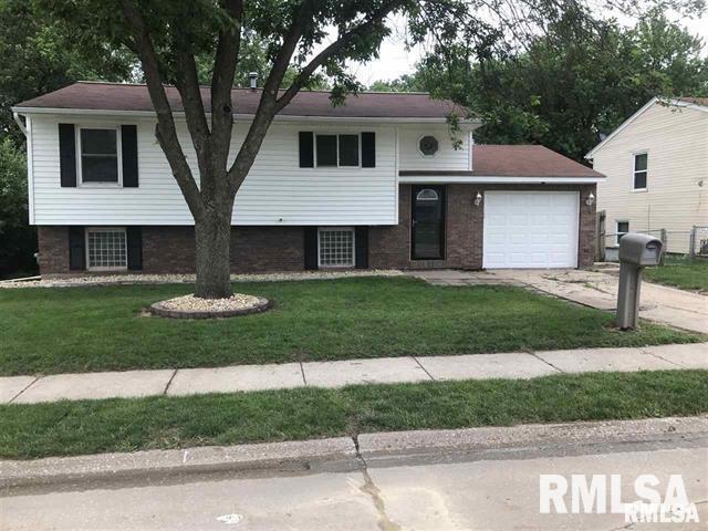 3218 Fairhaven Road Davenport, IA 52807 - Photo 6 of 7 a front view of a house with a yard