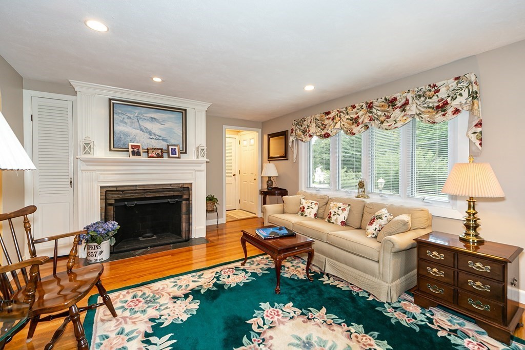357 Webster Street Needham, MA 02494 - Photo 17 of 30 a living room with furniture fireplace and a table