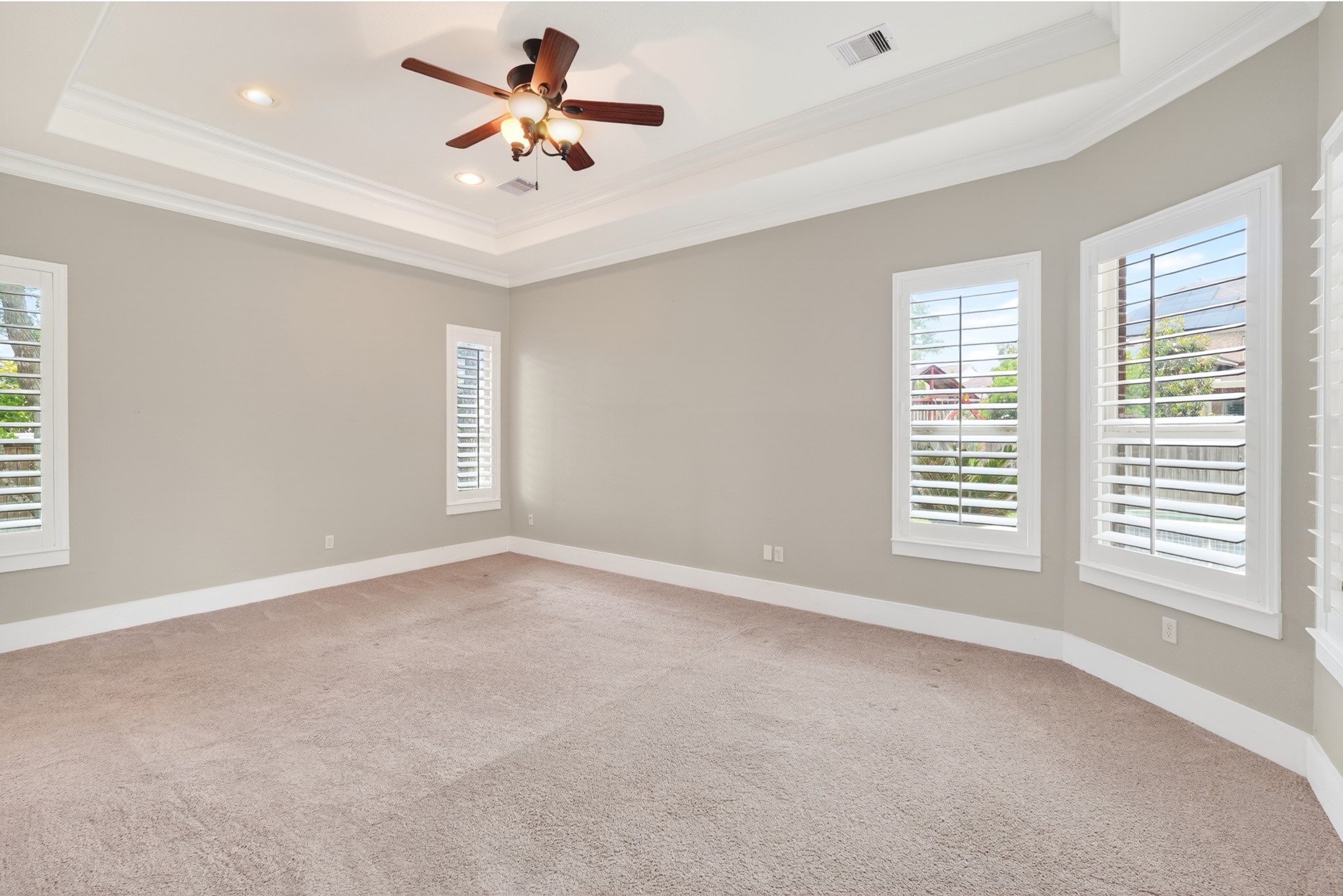 27 Hedgedale Way Spring, TX 77389 - Photo 16 of 43 Original photo shown for reference. Elegant king-sized primary bedroom, space for a cozy seating area, and abundant natural light filtering through stylish plantation shutters.