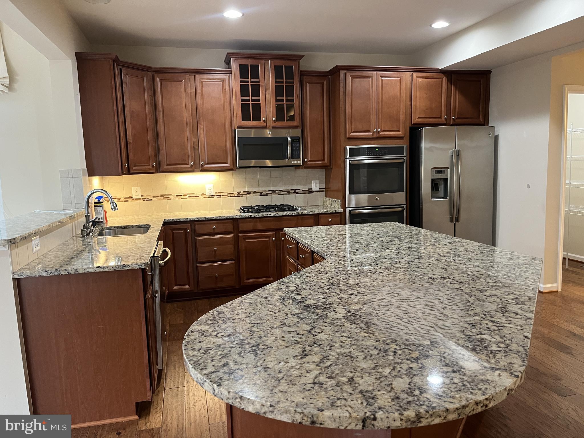 120 Standpipe Road Culpeper, VA 22701 - Photo 2 of 22 a kitchen with kitchen island a sink stove and refrigerator