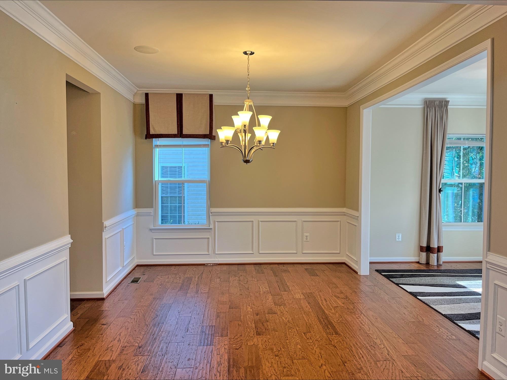 120 Standpipe Road Culpeper, VA 22701 - Photo 5 of 22 a view of empty room with wooden floor and fan