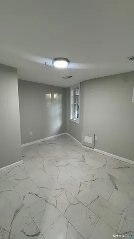 an empty room with a empty space and windows