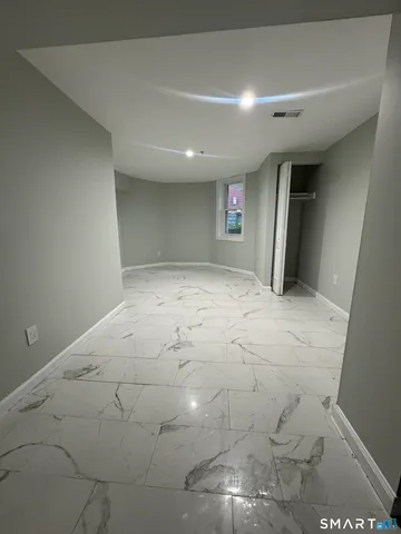 en empty room with wooden floor