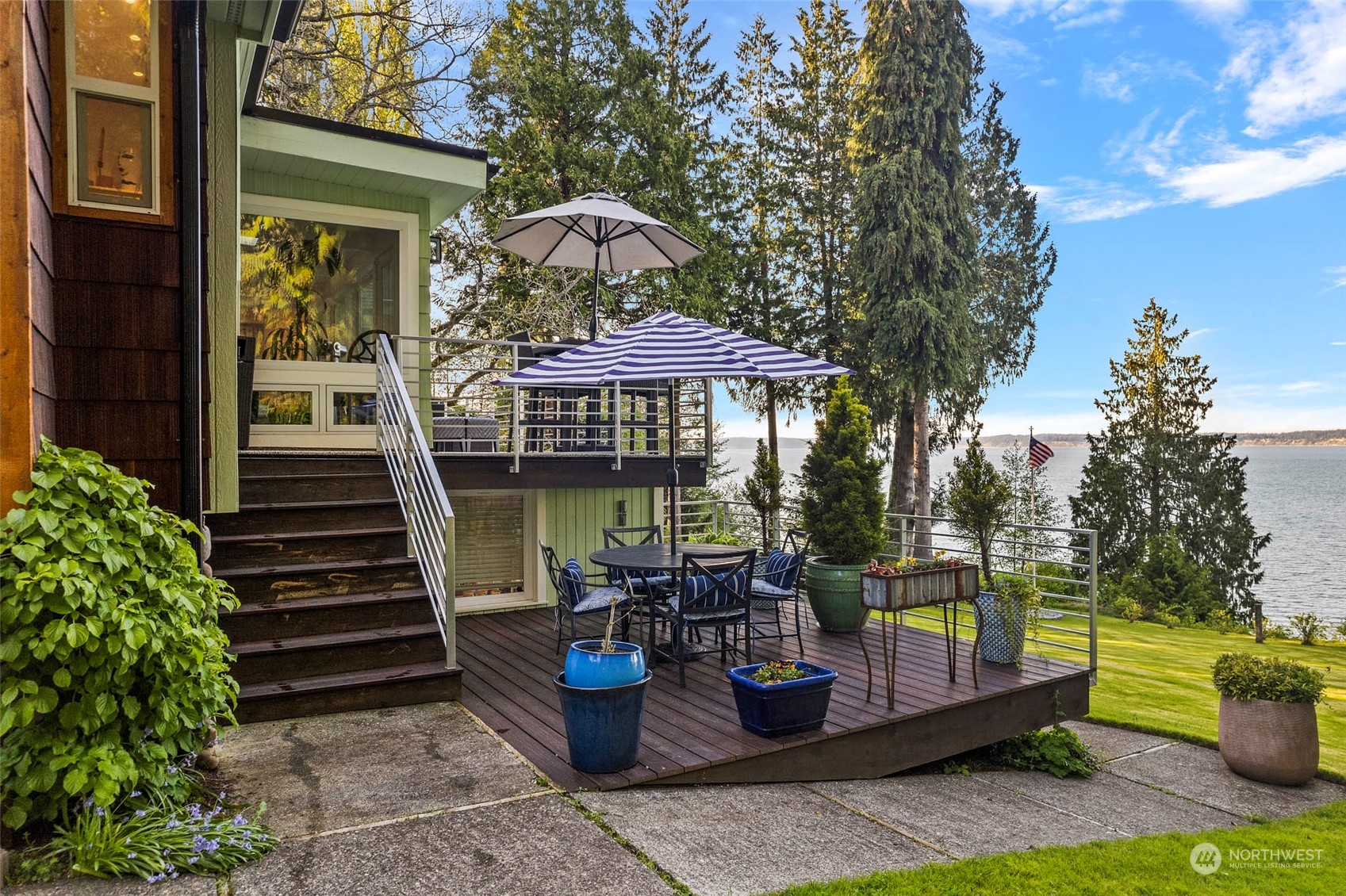 4903 Saratoga Road Langley, WA 98260 - Photo 12 of 40 a front view of a house with garden and chairs