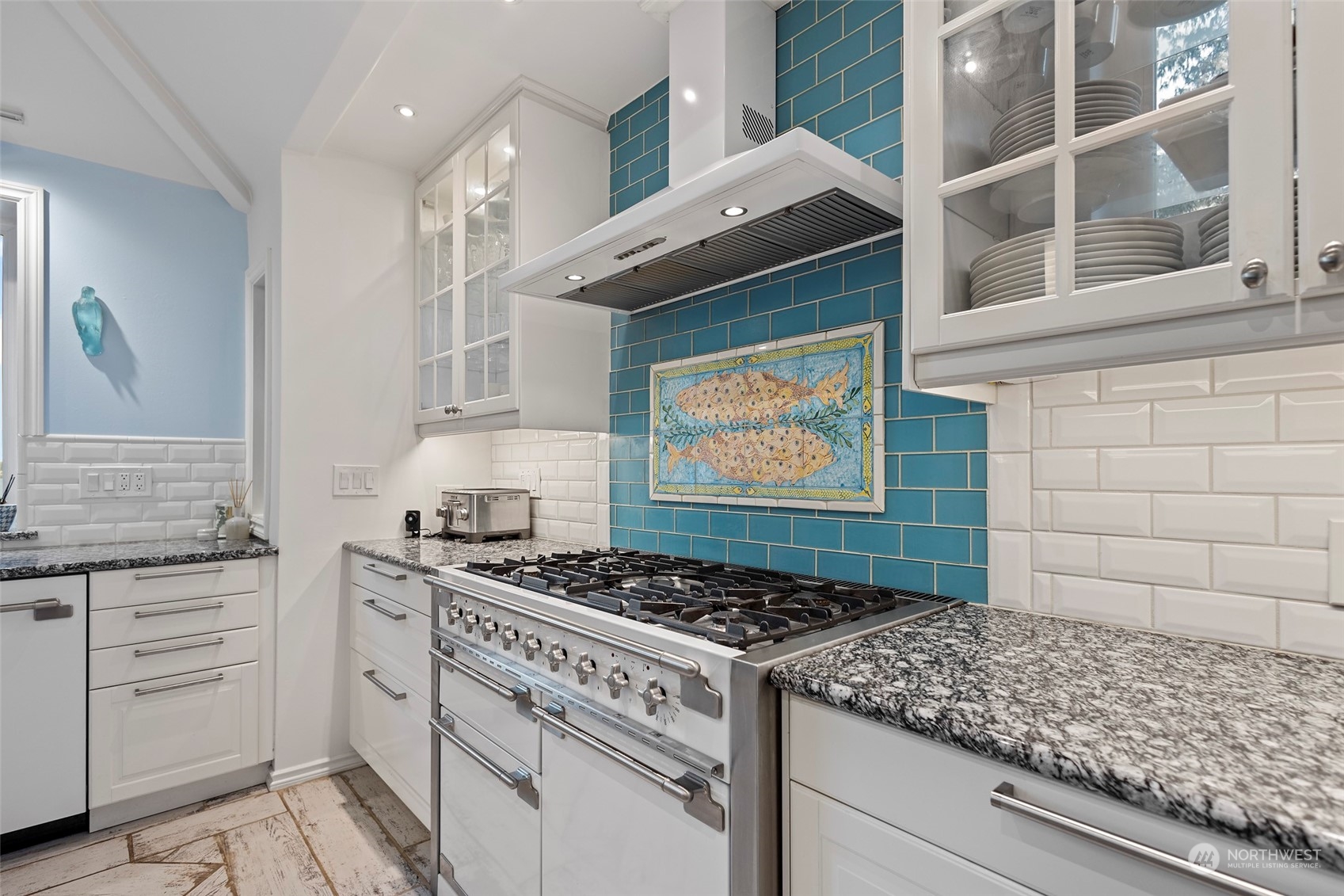 4903 Saratoga Road Langley, WA 98260 - Photo 15 of 40 a white stove top oven sitting inside of a kitchen