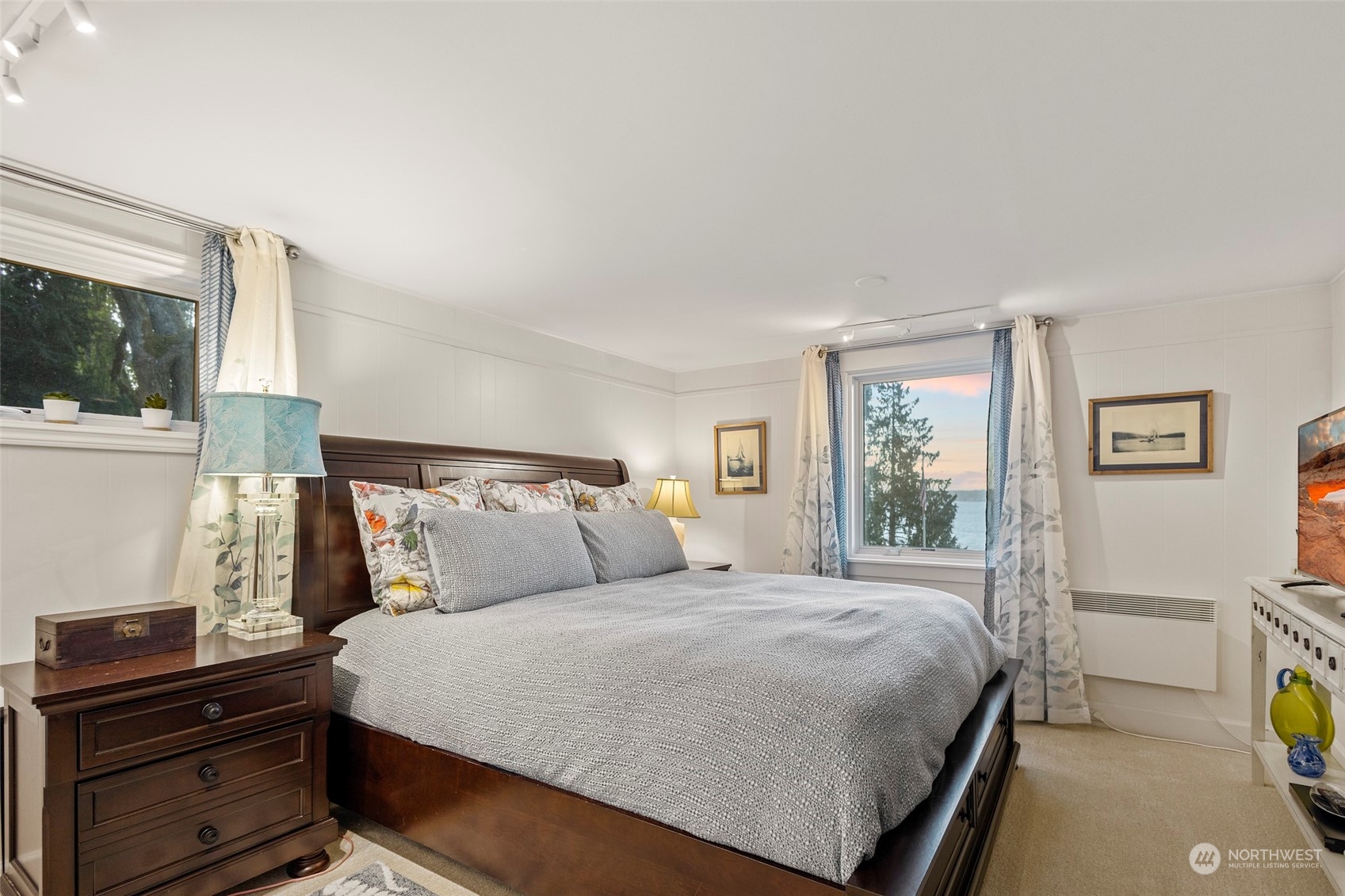 4903 Saratoga Road Langley, WA 98260 - Photo 16 of 40 a bedroom with a bed and a window