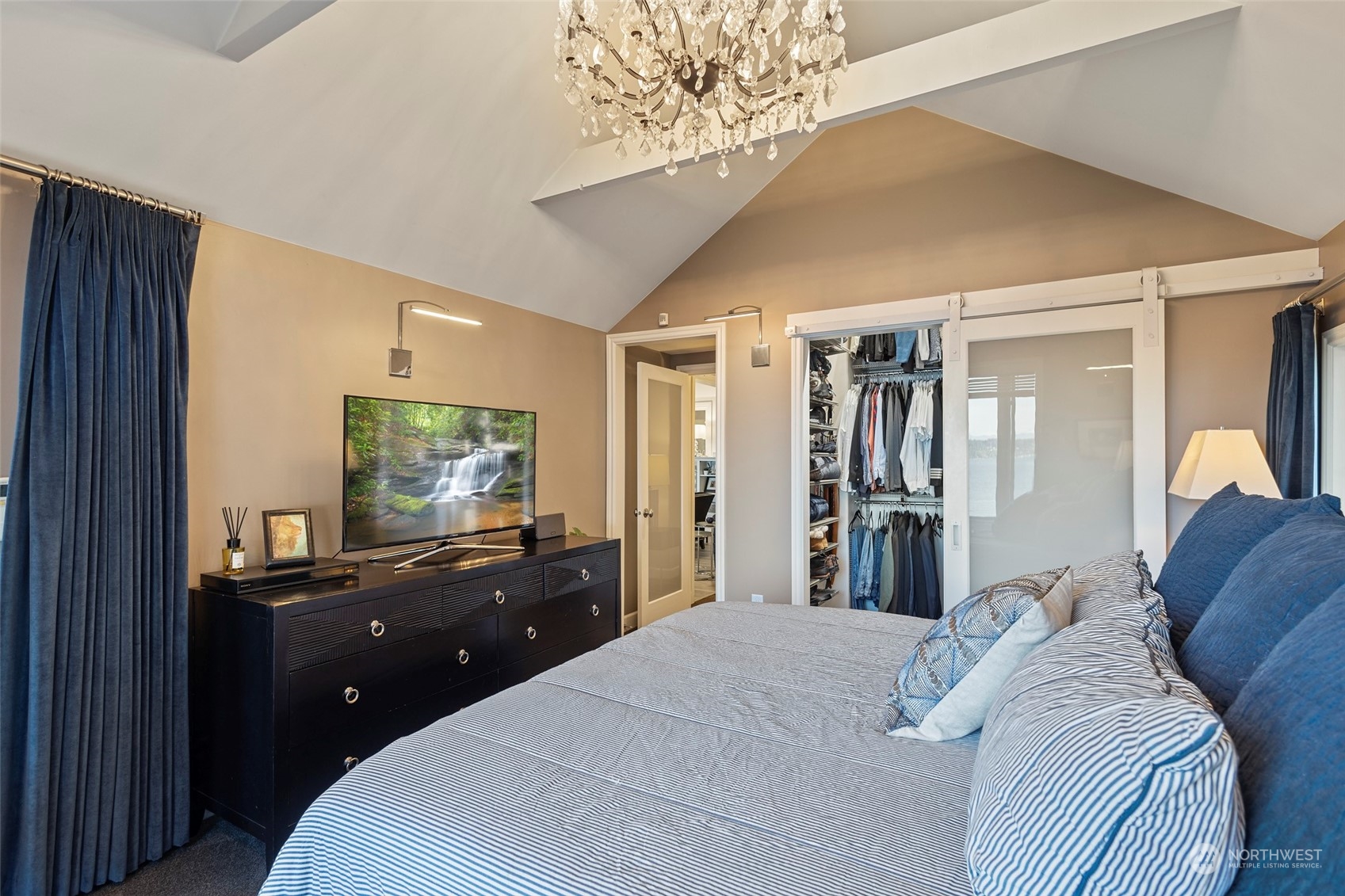 4903 Saratoga Road Langley, WA 98260 - Photo 18 of 40 a bedroom with a bed and a dresser