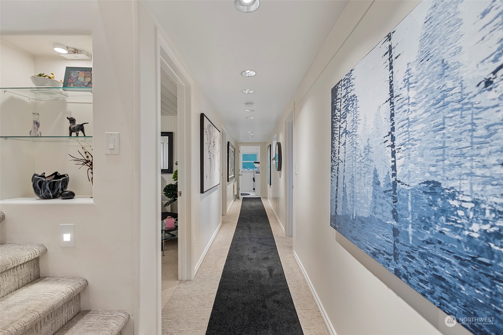 4903 Saratoga Road Langley, WA 98260 - Photo 21 of 40 a view of a hallway with furniture and stairs