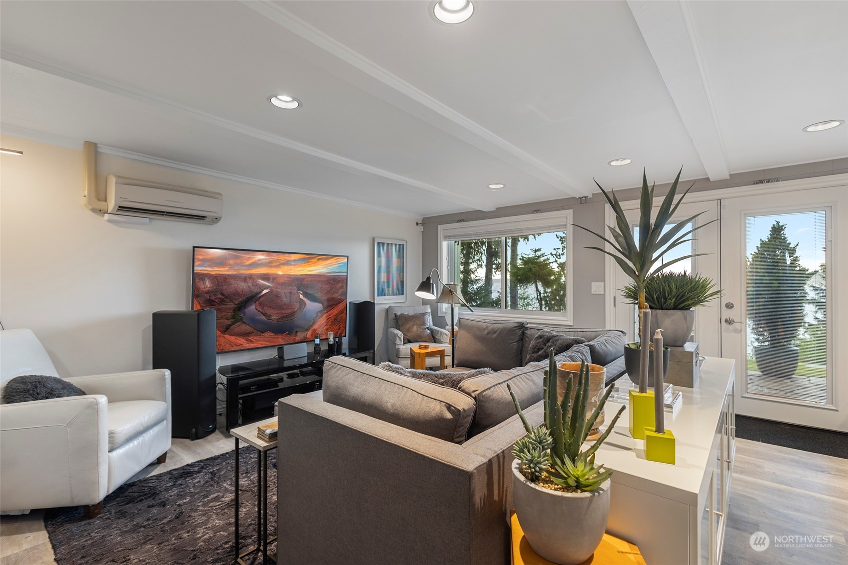 4903 Saratoga Road Langley, WA 98260 - Photo 22 of 40 a living room with furniture and a flat screen tv