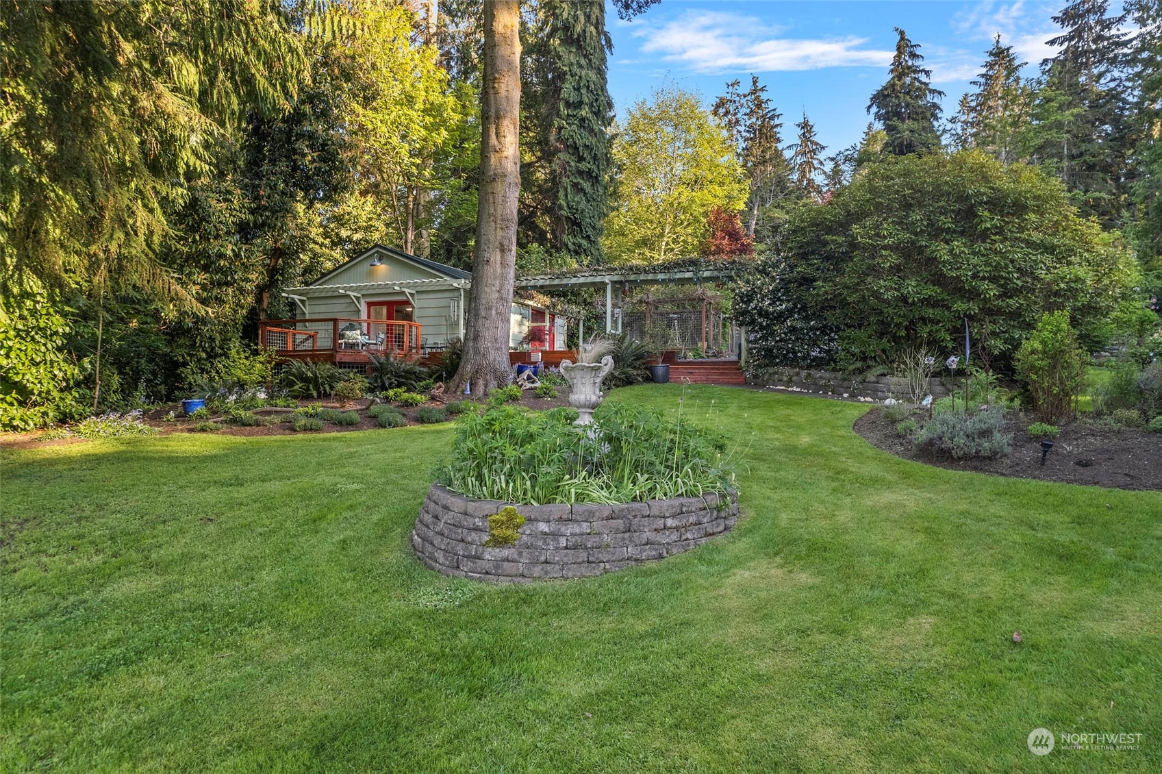 4903 Saratoga Road Langley, WA 98260 - Photo 29 of 40 a front view of a house with a garden and trees