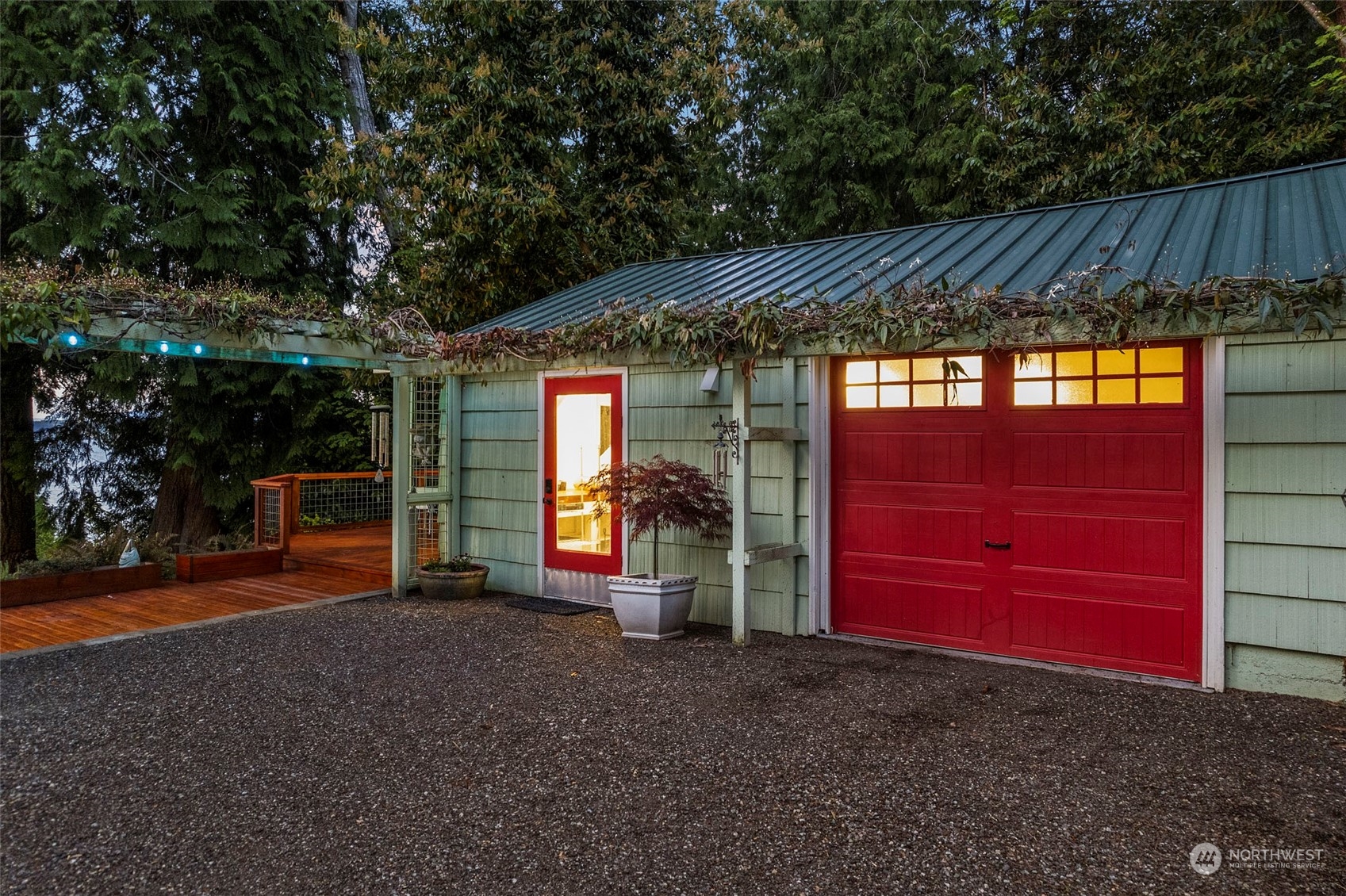 4903 Saratoga Road Langley, WA 98260 - Photo 31 of 40 a view of a house with a backyard