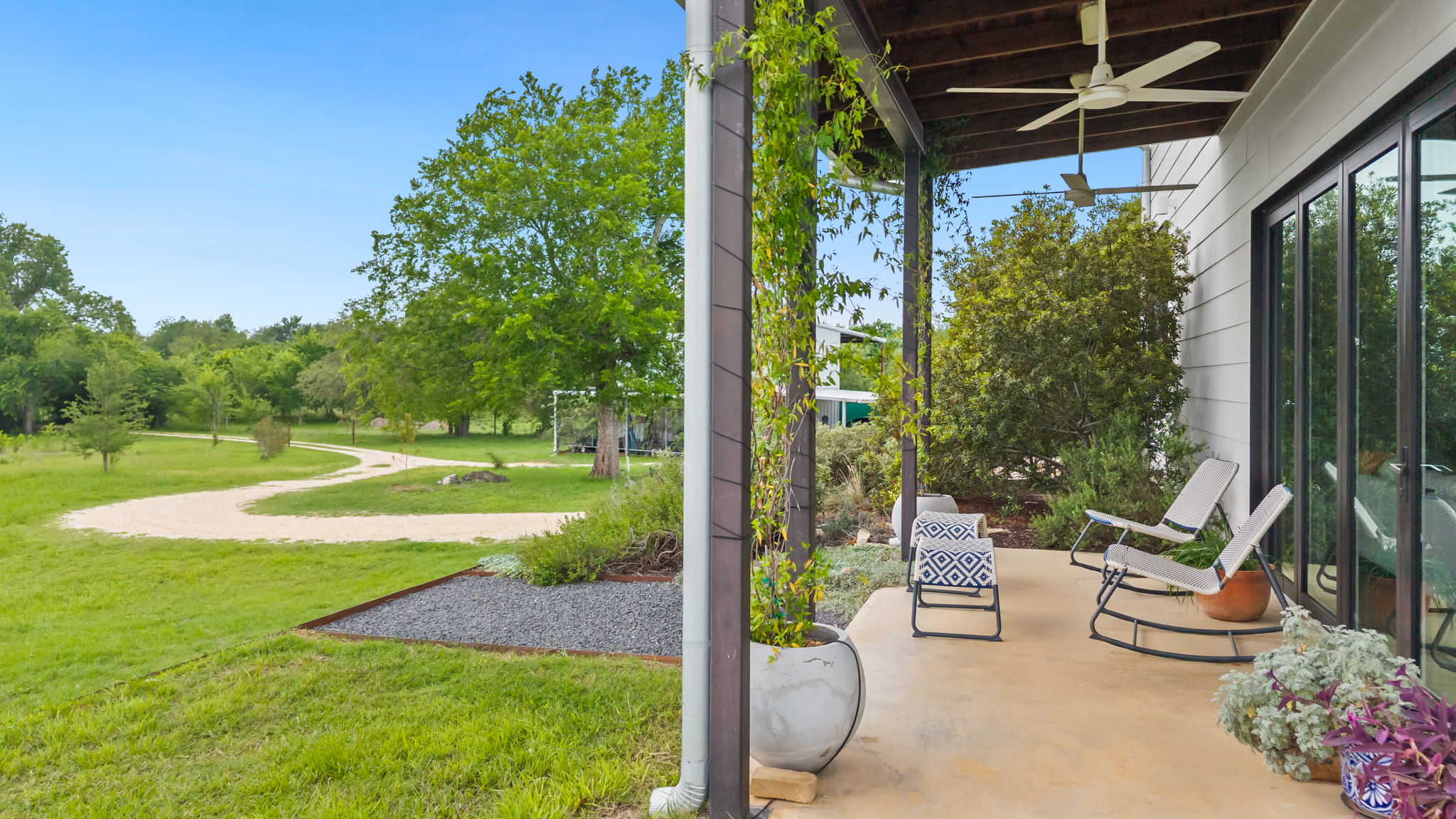 534 Old McDade Road Elgin, TX 78621 - Photo 7 of 40 View from front porch shows idyllic country property. Current owners have been working to revive the natural prairie land and reforestation of the property.