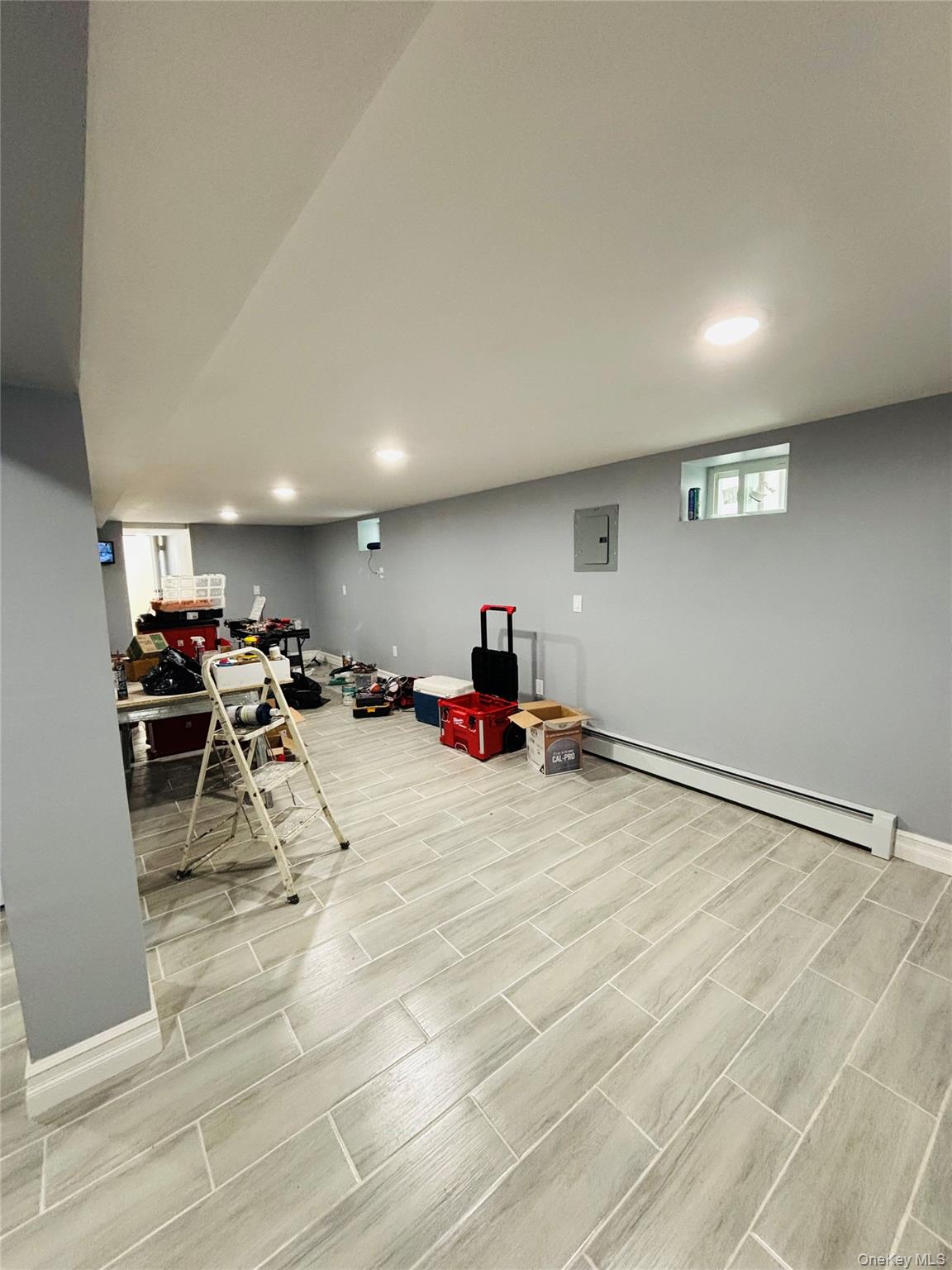 104-39 210th Street Queens, NY 11429 - Photo 12 of 18 a room with lots of furniture and a table