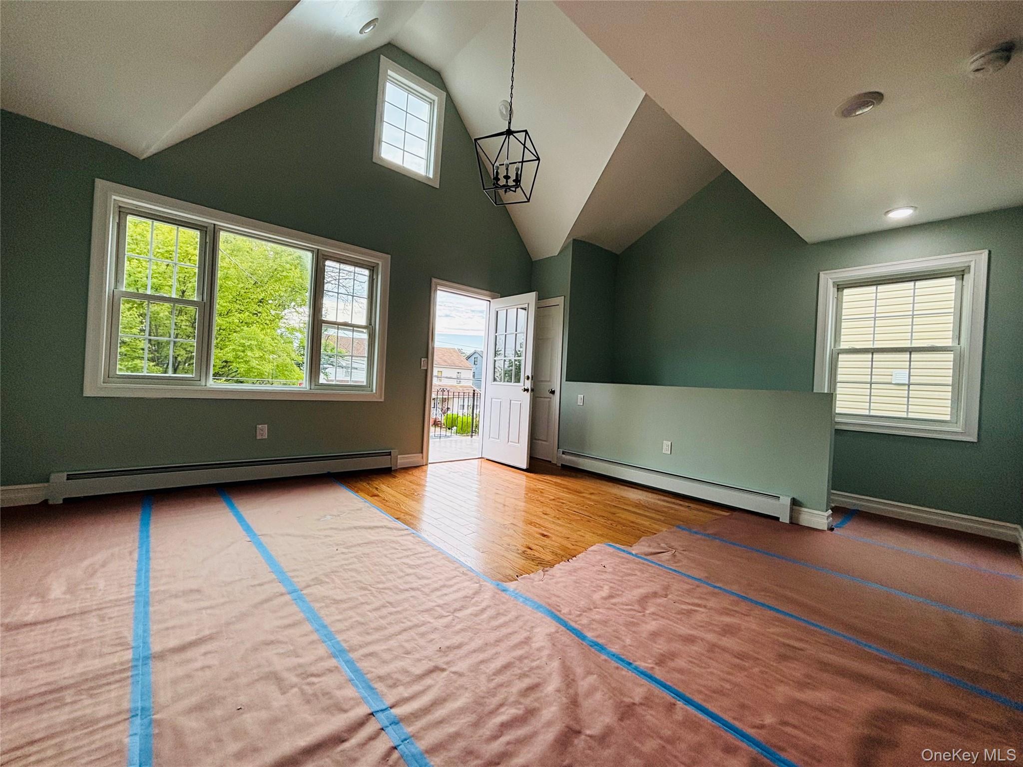 104-39 210th Street Queens, NY 11429 - Photo 14 of 18 a view of livingroom with hardwood floor and a ceiling fan