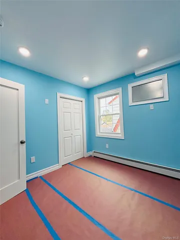 a view of sitting area in balcony with window